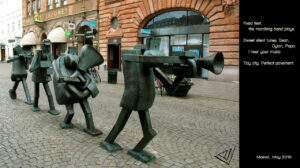 Bronce statues of four walking trumpet musicians