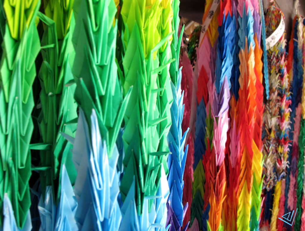crane-shaped origami paper in various colours