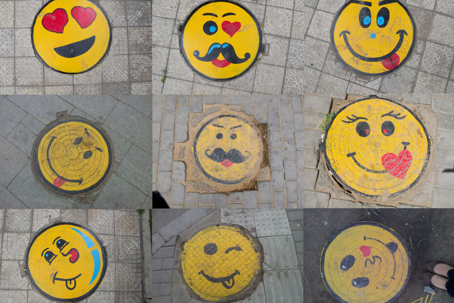 yellow manholes with smiley faces on them